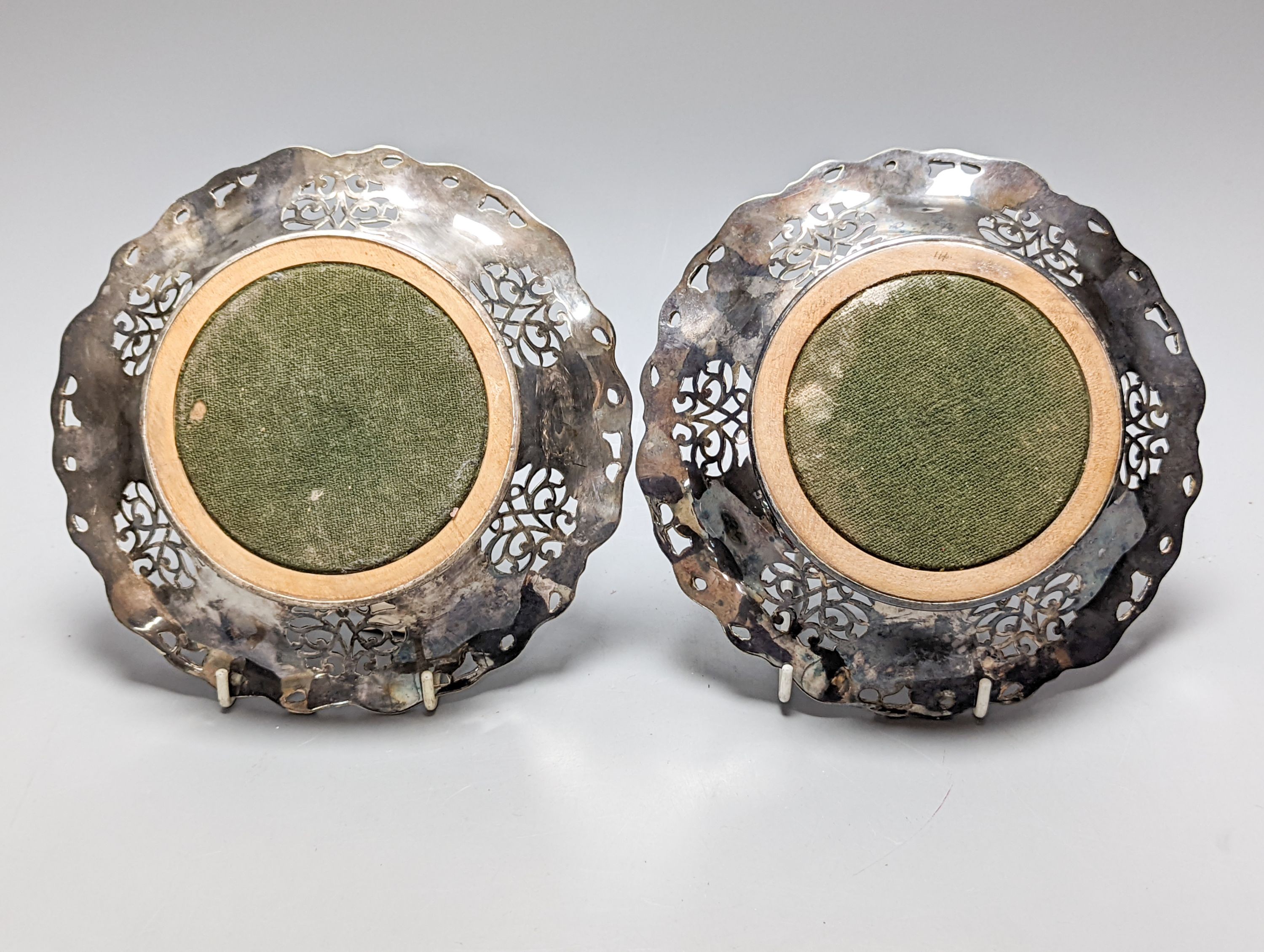 A pair of silver plated wine coasters 20cm